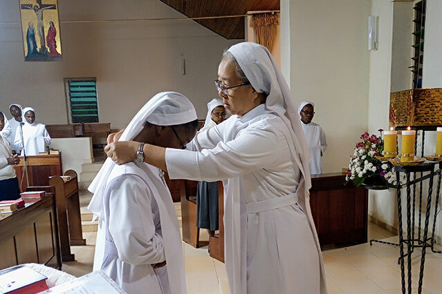 receives the Mission Cross